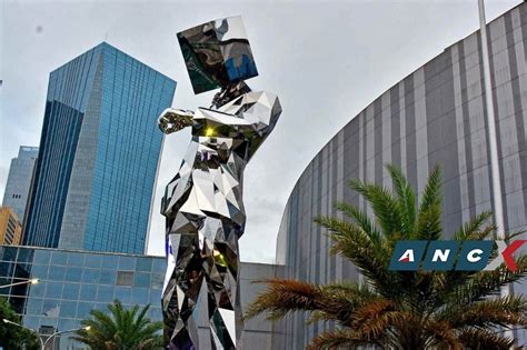 artwork sm megamall|The man behind this shiny new statue at SM .